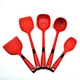 red kitchen utensil crock
